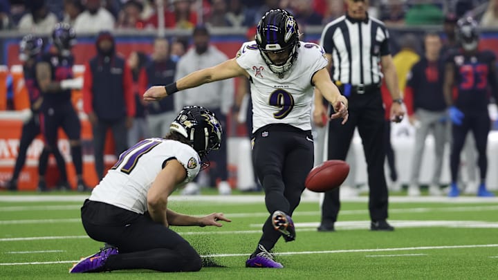 Dec 25, 2024; Houston, Texas, USA; Baltimore Ravens place kicker Justin Tucker (9) makes an extra point against the Houston Texans in the first quarter at NRG Stadium. Mandatory Credit: Thomas Shea-Imagn Images