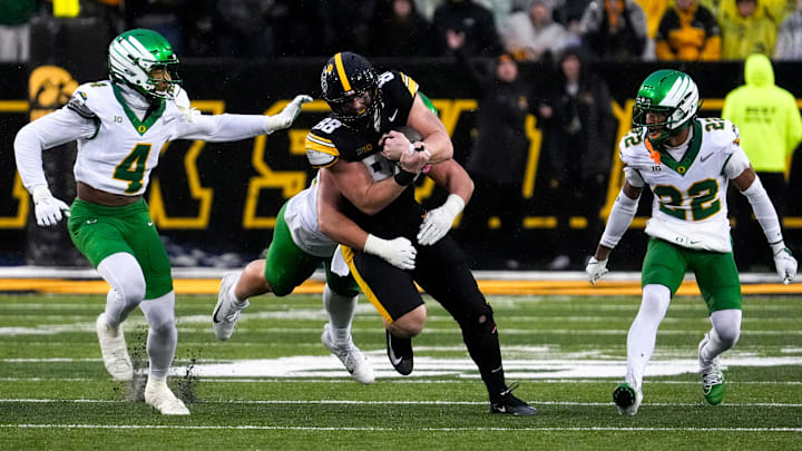 Iowa tight end Hayden Large runs for extra yards after a catch against Oregon.