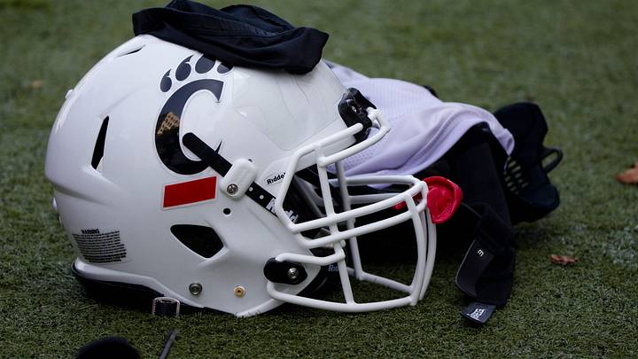 A Cincinnati Bearcats helmet and gloves sits on the turf during Cincinnati Bearcats football practice Wednesday, July 31, 2019, at the University of Cincinnati.
Cincinnati Bearcats 107 A Cincinnati Bearcats helmet and gloves sits on the turf during Cincinnati Bearcats football practice Wednesday, July 31, 2019, at the University of Cincinnati.
Cincinnati Bearcats 107