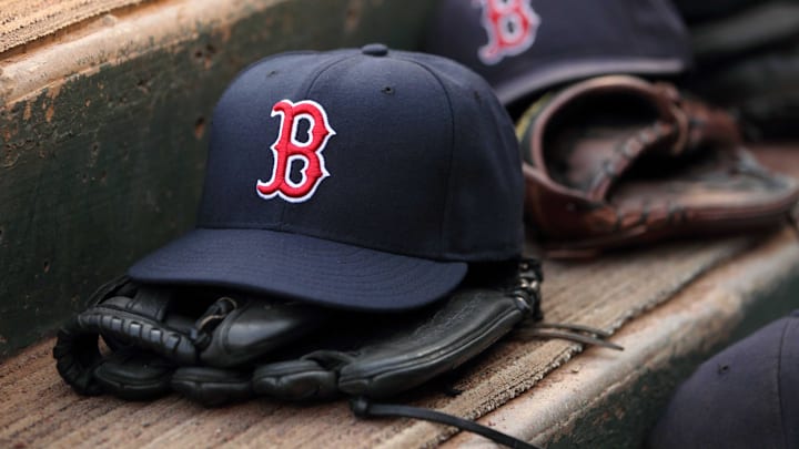 Aug 23, 2011; Arlington, TX, USA; Hats and gloves from the Boston Red Sox team near the edge of the dugout before the game against the Texas Rangers at Rangers Ballpark. Mandatory Credit: Kevin Jairaj-Imagn Images Aug 23, 2011; Arlington, TX, USA; Hats and gloves from the Boston Red Sox team near the edge of the dugout before the game against the Texas Rangers at Rangers Ballpark. Mandatory Credit: Kevin Jairaj-Imagn Images