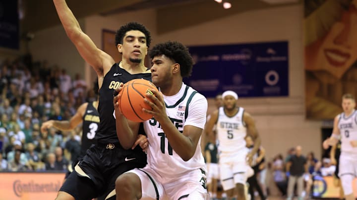 Nov 25, 2024; Lahaina, Hawaii, USA;  Colorado Buffaloes guard RJ Smith (5) defends Michigan State Spartans guard Jase Richardson (11) in the first half of an NCAA college basketball game at Lahaina Civic Center. Mandatory Credit: Marco Garcia-Imagn Images