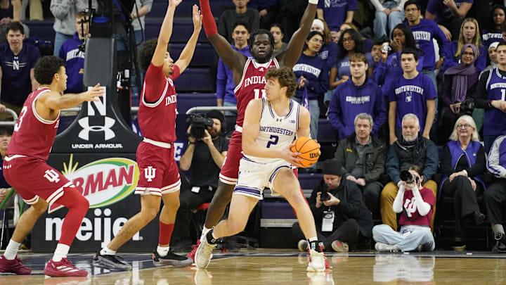 Jan 22, 2025; Evanston, Illinois, USA; Indiana Hoosiers center Oumar Ballo (11) defends Northwestern Wildcats forward Nick Martinelli (2) during the first half at Welsh-Ryan Arena. Mandatory Credit: David Banks-Imagn Images Jan 22, 2025; Evanston, Illinois, USA; Indiana Hoosiers center Oumar Ballo (11) defends Northwestern Wildcats forward Nick Martinelli (2) during the first half at Welsh-Ryan Arena. Mandatory Credit: David Banks-Imagn Images
