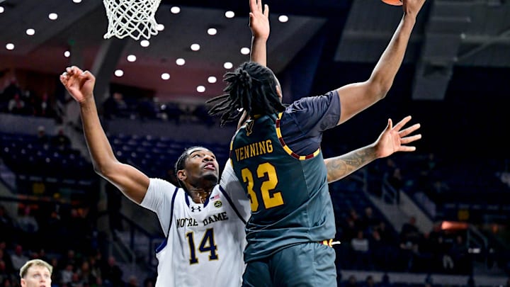 Jan 13, 2025; South Bend, Indiana, USA; Boston College Eagles forward Chad Venning (32) goes up for a shot as Notre Dame Fighting Irish forward Kebba Njie (14) defends in the first half at the Purcell Pavilion. Mandatory Credit: Matt Cashore-Imagn Images Jan 13, 2025; South Bend, Indiana, USA; Boston College Eagles forward Chad Venning (32) goes up for a shot as Notre Dame Fighting Irish forward Kebba Njie (14) defends in the first half at the Purcell Pavilion. Mandatory Credit: Matt Cashore-Imagn Images
