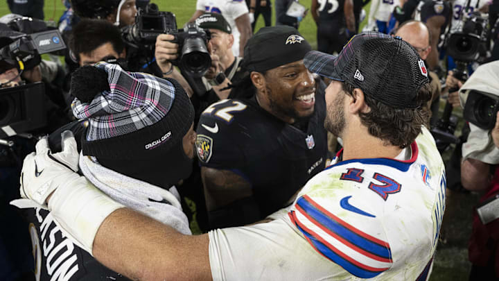 Allen speaks with Henry and Jackson after a game. 