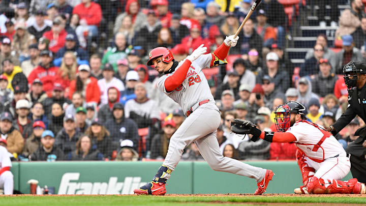 Apr 6, 2025; Boston, Massachusetts, USA; St. Louis Cardinals third baseman Nolan Arenado (28) hits a single during the third inning against the Boston Red Sox at Fenway Park. Mandatory Credit: Eric Canha-Imagn Images Apr 6, 2025; Boston, Massachusetts, USA; St. Louis Cardinals third baseman Nolan Arenado (28) hits a single during the third inning against the Boston Red Sox at Fenway Park. Mandatory Credit: Eric Canha-Imagn Images