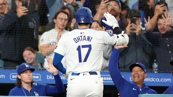 Sep 20, 2024; Los Angeles, California, USA; Los Angeles Dodgers designated hitter Shohei Ohtani (17) celebrates with manager Dave Roberts (30) after hitting a two-run home run in the fifth inning against the Colorado Rockies at Dodger Stadium. 