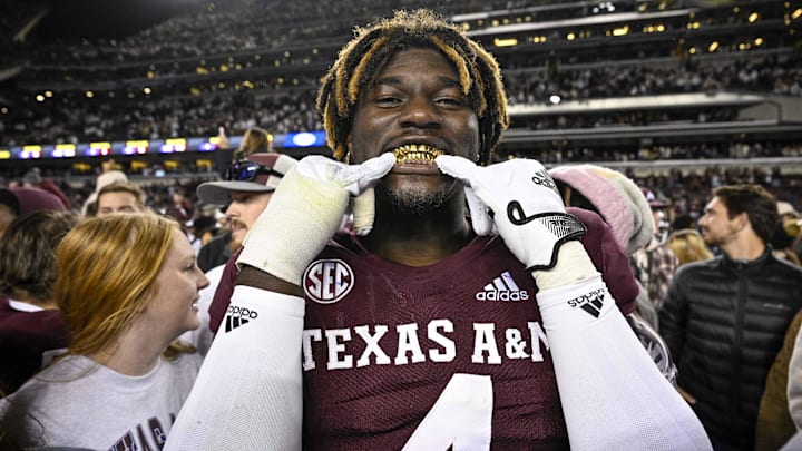 Nov 26, 2022; College Station, Texas, USA; Texas A&M Aggies defensive lineman Shemar Stewart (4) shows off his gold grill smile after the Aggies defeat the LSU Tigers at Kyle Field. Mandatory Credit: Jerome Miron-Imagn Images