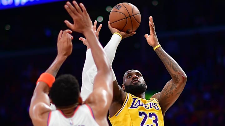 Mar 6, 2025; Los Angeles, California, USA; Los Angeles Lakers forward LeBron James (23) shoots against New York Knicks center Karl-Anthony Towns (32) during overtime at Crypto.com Arena. Mandatory Credit: Gary A. Vasquez-Imagn Images Mar 6, 2025; Los Angeles, California, USA; Los Angeles Lakers forward LeBron James (23) shoots against New York Knicks center Karl-Anthony Towns (32) during overtime at Crypto.com Arena. Mandatory Credit: Gary A. Vasquez-Imagn Images