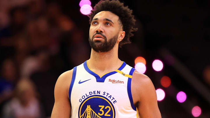 Apr 8, 2025; Phoenix, Arizona, USA; Golden State Warriors forward Trayce Jackson-Davis (32) against the Phoenix Suns at Footprint Center. Mandatory Credit: Mark J. Rebilas-Imagn Images