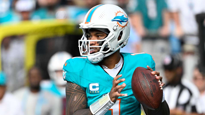 Miami Dolphins quarterback Tua Tagovailoa (1) looks to pass in the fourth quarter at Bank of America Stadium.