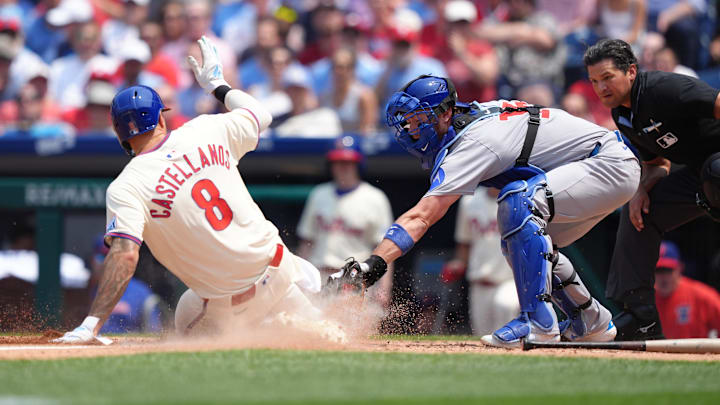 Jun 11, 2025; Philadelphia, Pennsylvania, USA; Chicago Cubs catcher Carson Kelly (15) tags Philadelphia Phillies outfielder Nick Castellanos (8) out at home in the third inning at Citizens Bank Park.