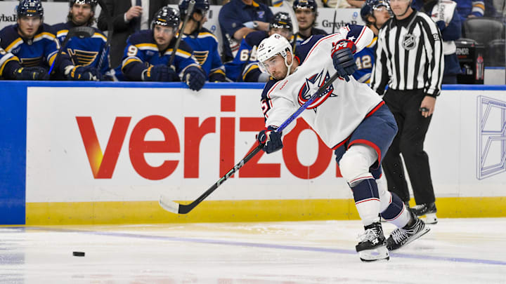 Oct 1, 2024; St. Louis, Missouri, USA;  Columbus Blue Jackets defenseman David Jiricek (55) shoots against the St. Louis Blues during the first period at Enterprise Center. Mandatory Credit: Jeff Curry-Imagn Images