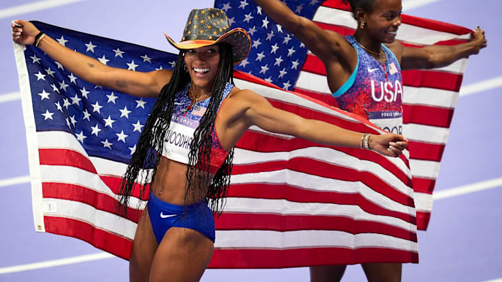 Tara Davis-Woodhall and Jasmine Moore celebrate after winning gold and bronze in the women’s long jump during the Paris 2024 Olympic Summer Games.