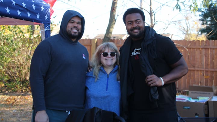 Lodi, NJ -- November 13, 2024 -- Giants OT Jermaine Eluemunor and rookie OT Marcellus Johnson pose at Eluemunor's Turkey Giveaway Event.