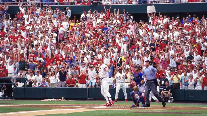 Sep 7, 1998; St. Louis, MO, USA; FILE PHOTO; St. Louis Cardinals infielder Mark McGwire hits his 61st home run of the season during a game against the Chicago Cubs at Busch Stadium. With that home run, McGwire tied the record for the most home runs in a single season. Mandatory Credit: VJ Lovero-USA TODAY NETWORK