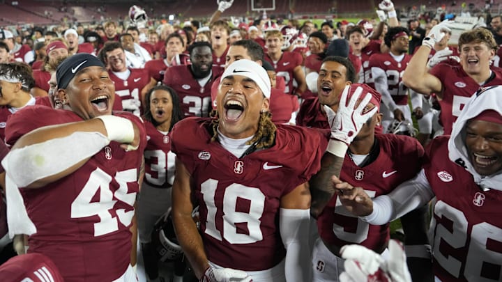 Sep 13, 2025; Stanford, California, USA; Stanford Cardinal players celebrate on the field after defeating the Boston College Eagles at Stanford Stadium. Mandatory Credit: Darren Yamashita-Imagn Images