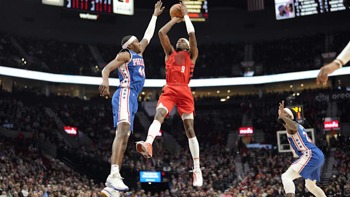 Jan 29, 2024; Portland, Oregon, USA; Portland Trail Blazers small forward Jerami Grant (9) shoots the ball over Philadelphia 76ers small forward Paul Reed (44) during the first half at Moda Center. Mandatory Credit: Soobum Im-Imagn Images