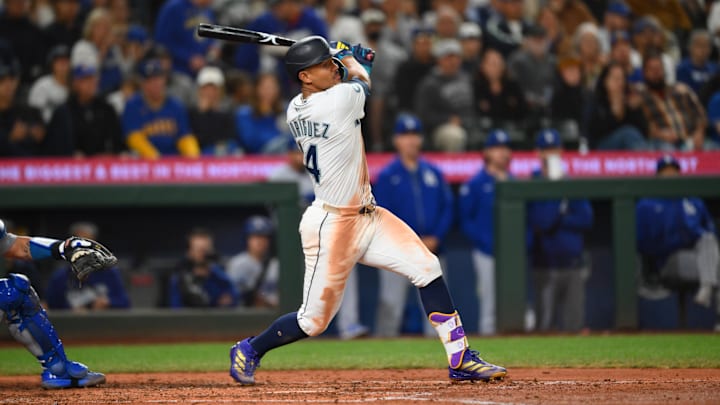 Sep 27, 2025; Seattle, Washington, USA; Seattle Mariners center fielder Julio Rodriguez (44) hits a single against the Los Angeles Dodgers during the fifth inning at T-Mobile Park. Mandatory Credit: Steven Bisig-Imagn Images