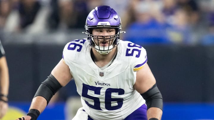 Jan 13, 2025; Glendale, AZ, USA; Minnesota Vikings center Garrett Bradbury (56) against the Los Angeles Rams during an NFC wild card game at State Farm Stadium. Mandatory Credit: Mark J. Rebilas-Imagn Images