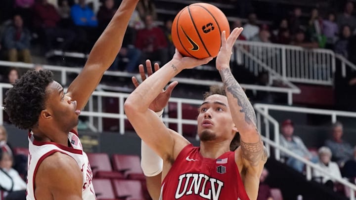 UNLV Runnin' Rebels guard Dra Gibbs-Lawhorn (0) shoots against Stanford Cardinal guard Ebuka Okorie (1) in the second half at Maples Pavilion. Mandatory Credit: David Gonzales-Imagn Images