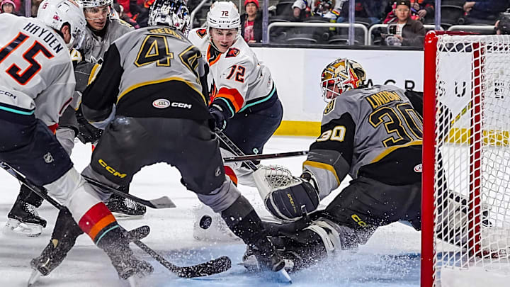 Coachella Valley Firebirds center Andrei Loshko makes an unsuccessful attempt on the goal as Henderson Silver Knights goalie Carl Lindbom gets low to protect the net during the second period of their game at Acrisure Arena in Palm Desert, Calif., Wednesday, Jan. 7, 2026.