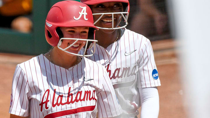May 19 2024; Tuscaloosa, AL, USA; Alabama base runner Larissa Preuitt (11) and Alabama base runner Kristen White (3) are all smiles after scoring runs at Rhoads Stadium Sunday. Alabama defeated Southeastern Louisiana 12-2 in 5 innings to advance to the Super Regional.