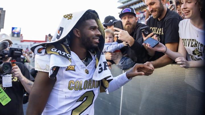 Oct 19, 2024; Tucson, Arizona, USA; Colorado Buffalos quarterback Shedeur Sanders (2) greets fans after defeating the Arizona Wildcats at Arizona Stadium. Mandatory Credit: Mark J. Rebilas-Imagn Images