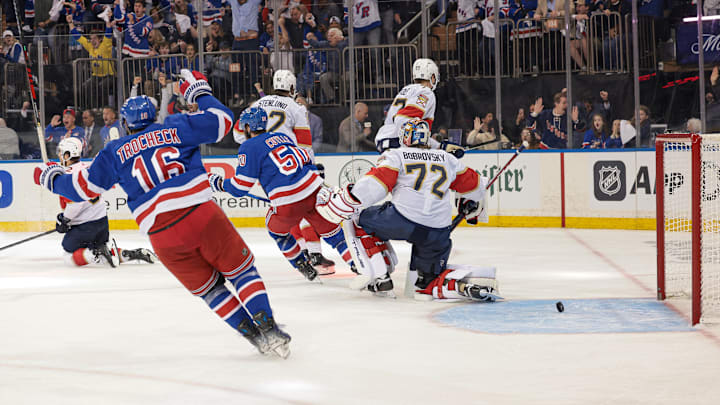 May 24, 2024; New York, New York, USA; New York Rangers center Vincent Trocheck (16) and left wing Will Cuylle (50) celebrate an goal by center Barclay Goodrow (21) against Florida Panthers goaltender Sergei Bobrovsky (72) during overtime in game two of the Eastern Conference Final of the 2024 Stanley Cup Playoffs at Madison Square Garden. Mandatory Credit: Vincent Carchietta-USA TODAY Sports