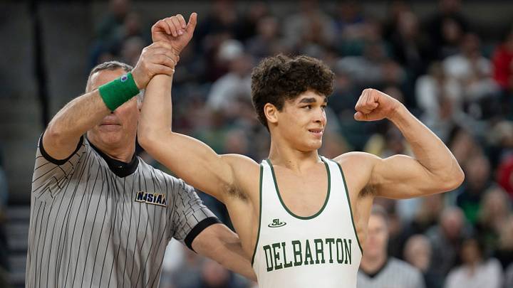 Delbarton’s Jayden James’s hand is raised after defeating Delsea’s Jamar Dixon Jr. in the championship 150lb match during finals of the NJSIAA individual wrestling state championships at Boardwalk Hall in Atlantic City on Friday, March 8, 2025. Delbarton’s Jayden James is awarded the 150lb state championship title.