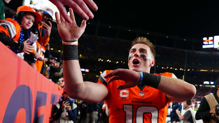 Dec 14, 2025; Denver, Colorado, USA; Denver Broncos quarterback Bo Nix (10) high-fives fans after defeating the Green Bay Packers at Empower Field at Mile High. Mandatory Credit: Ron Chenoy-Imagn Images Dec 14, 2025; Denver, Colorado, USA; Denver Broncos quarterback Bo Nix (10) high-fives fans after defeating the Green Bay Packers at Empower Field at Mile High. Mandatory Credit: Ron Chenoy-Imagn Images