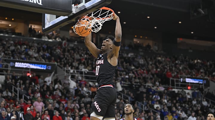Mar 20, 2025; Providence, RI, USA;  Omaha Mavericks forward Marquel Sutton (10) scores against St. John's Red Storm during the first half at Amica Mutual Pavilion. Mandatory Credit: Eric Canha-Imagn Images