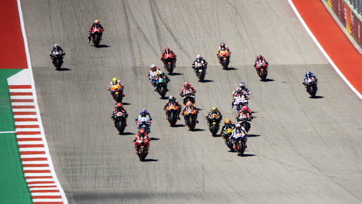 Apr 16, 2023; Austin, TX, USA; MotoGP racers climb the first hill during the start of the Red Bull Apr 16, 2023; Austin, TX, USA; MotoGP racers climb the first hill during the start of the Red Bull