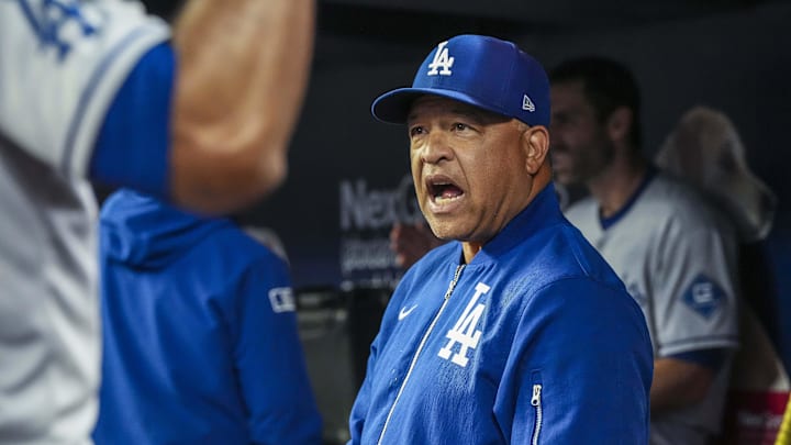 May 3, 2025; Cumberland, Georgia, USA; Los Angeles Dodgers manager Dave Roberts (30) reacts in the dugout against the Atlanta Braves during the second inning at Truist Park. Mandatory Credit: Dale Zanine-Imagn Images