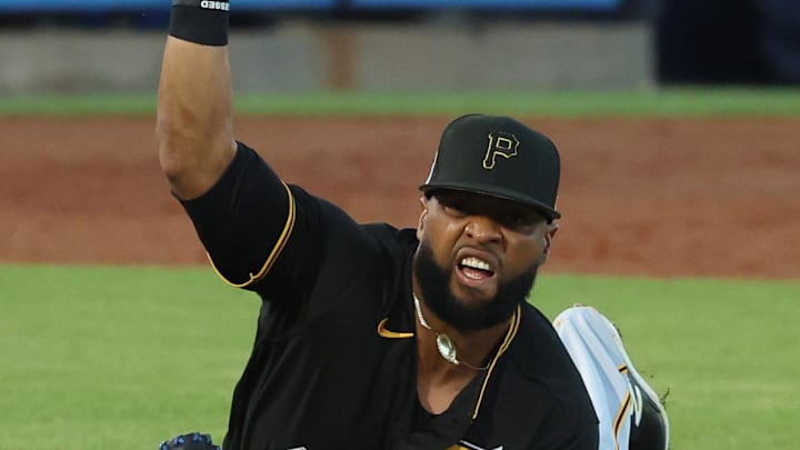 Mar 16, 2023; Tampa, Florida, USA;  Pittsburgh Pirates first baseman Carlos Santana (41) falls as he