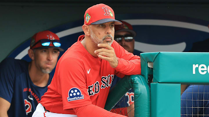 Feb 22, 2026; Fort Myers, Florida, USA; Boston Red Sox manager Alex Cora (13) looks on from the dugout during the third inning against the Toronto Blue Jays  at JetBlue Park at Fenway South. Mandatory Credit: Kim Klement Neitzel-Imagn Images