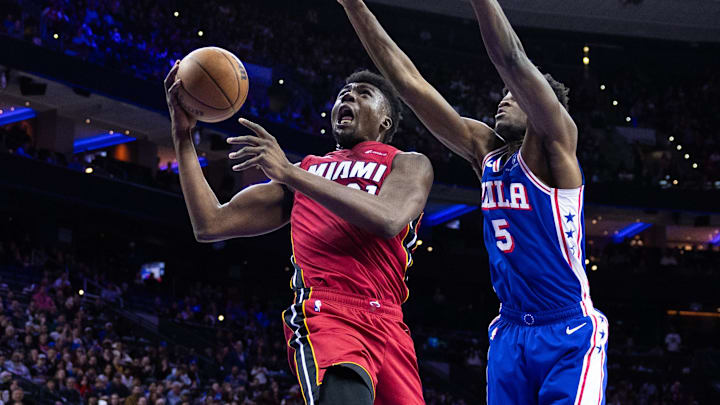 Mar 18, 2024; Philadelphia, Pennsylvania, USA; Miami Heat center Thomas Bryant (31) drives for a shot against Philadelphia 76ers center Mo Bamba (5) during the fourth quarter at Wells Fargo Center. Mandatory Credit: Bill Streicher-Imagn Images