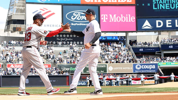 Red Sox manager Alex Cora and Yankee manager Aaron Boone shake hands prior to start of opening day game at Yankee Stadium April 8, 2022.

Yankees Opening Day