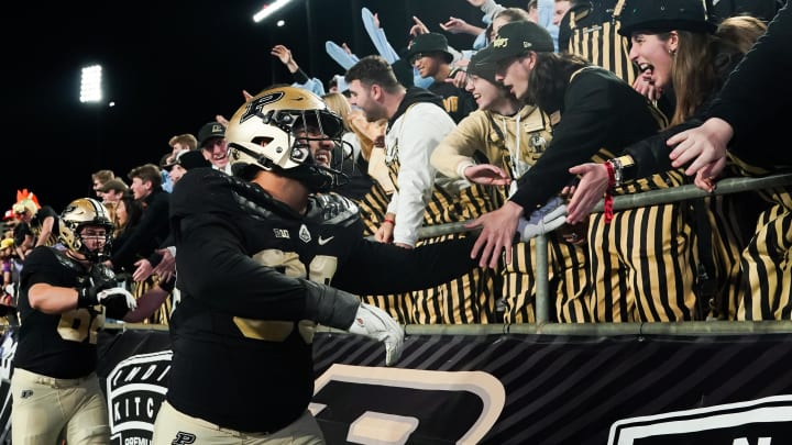 Purdue Boilermakers defensive lineman Isaiah Nichols (93) celebrates with fans Purdue Boilermakers defensive lineman Isaiah Nichols (93) celebrates with fans