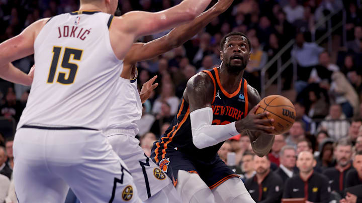 Jan 25, 2024; New York, New York, USA; New York Knicks forward Julius Randle (30) looks to shoot the ball against against Denver Nuggets forward Peyton Watson (8) and center Nikola Jokic (15) during the third quarter at Madison Square Garden. Mandatory Credit: Brad Penner-USA TODAY Sports Jan 25, 2024; New York, New York, USA; New York Knicks forward Julius Randle (30) looks to shoot the ball against against Denver Nuggets forward Peyton Watson (8) and center Nikola Jokic (15) during the third quarter at Madison Square Garden. Mandatory Credit: Brad Penner-USA TODAY Sports