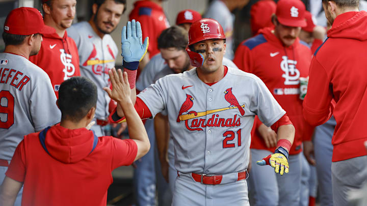 Jun 19, 2025; Chicago, Illinois, USA; St. Louis Cardinals left fielder Lars Nootbaar (21) celebrates with teammates in the dugout after hitting a solo home run against the Chicago White Sox during the tenth inning of game two of a doubleheader at Rate Field. Mandatory Credit: Kamil Krzaczynski-Imagn Images