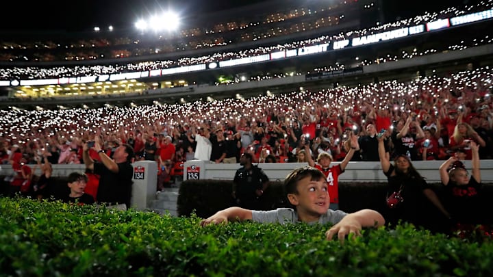 Georgia fans light up Sanford Stadium as the game goes into the fourth during the second half of a NCAA college football game against Tennessee Martin in Athens, Ga., on Saturday, Sept. 2, 2023. Georgia won 48-7.