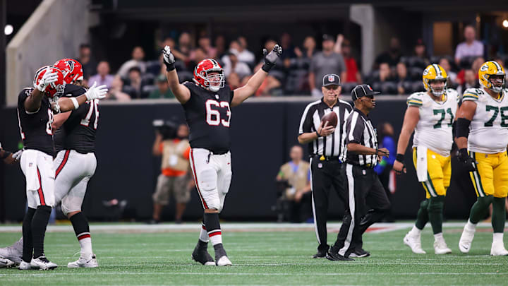 Sep 17, 2023; Atlanta, Georgia, USA; Atlanta Falcons guard Chris Lindstrom (63) reacts after a turnover on downs to seal a victory against the Green Bay Packers in the second half at Mercedes-Benz Stadium. Mandatory Credit: Brett Davis-Imagn Images
