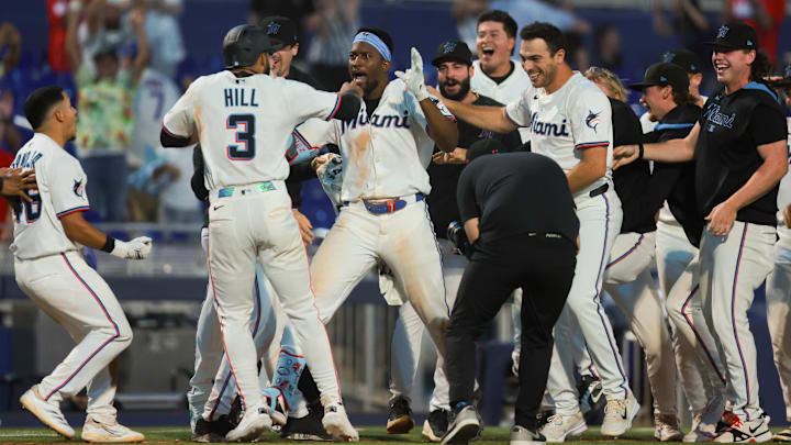 Miami Marlins right fielder Jesus Sanchez (7) celebrates with teammates after hitting a walk-off triple against the Chicago Cubs at loanDepot Park on May 19, 2025. Miami Marlins right fielder Jesus Sanchez (7) celebrates with teammates after hitting a walk-off triple against the Chicago Cubs at loanDepot Park on May 19, 2025.