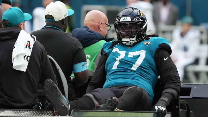 Oct 11, 2026; Tottenham, ENG;  Jacksonville Jaguars offensive line Anton Harrison (77) is carted off the field after an injury during the second half against the Philadelphia Eagles at Tottenham Hotspur Stadium.  Mandatory Credit: Kirby Lee-Imagn Images