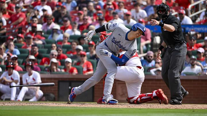 Jun 8, 2025; St. Louis, Missouri, USA;  Los Angeles Dodgers designated hitter Shohei Ohtani (17) reacts after he was hit by a pitch by St. Louis Cardinals relief pitcher Matt Svanson (not pictured) during the eighth inning at Busch Stadium. Mandatory Credit: Jeff Curry-Imagn Images