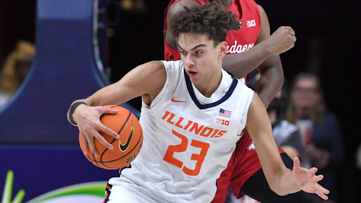 Feb 10, 2026; Champaign, Illinois, USA;  Illinois Fighting Illini guard Keaton Wagler (23) tries to control the ball in front of Wisconsin Badgers guard John Blackwell (25) during the second half at State Farm Center. Mandatory Credit: Ron Johnson-Imagn Images