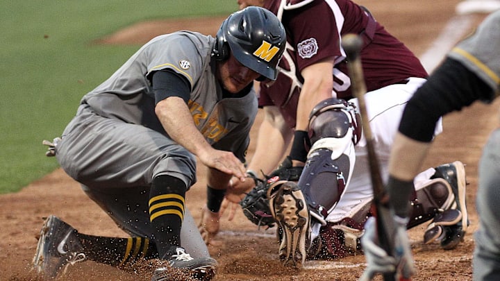 Mizzou's Dillion Everett slides past Missouri State catcher Luke Voit on Tuesday night at Hammons Field.

Baseball Missouri 5 Missouri State 4