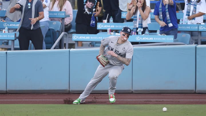 Oct 25, 2024; Los Angeles, California, USA; New York Yankees outfielder Alex Verdugo (24) runs for the ball in the first inning against the Los Angeles Dodgers  during game one of the 2024 MLB World Series at Dodger Stadium. Mandatory Credit:  Jason Parkhurst-Imagn Images