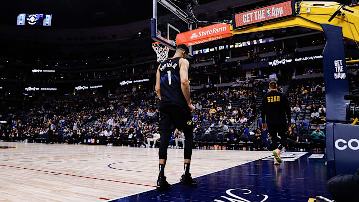 Denver Nuggets forward Michael Porter Jr. (1) and center Nikola Jokic (15) against the Minnesota Timberwolves at Ball Arena.