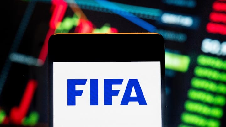 In this photo illustration, the Federation Internationale de...